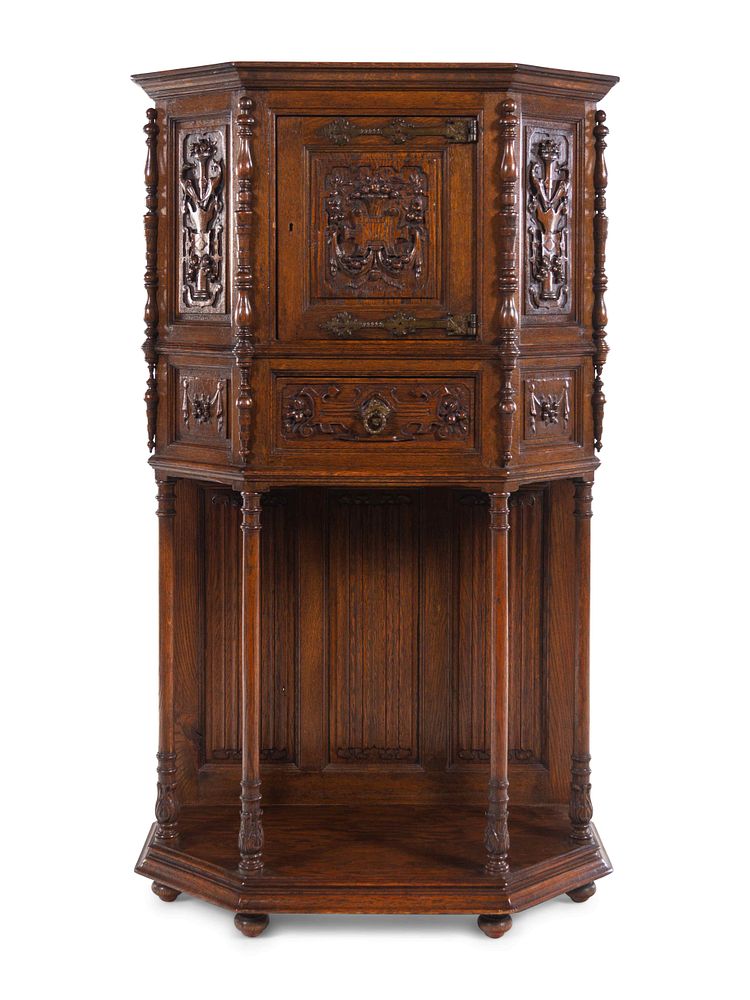 Appraisal: A Gothic Revival Carved Oak Cabinet on Stand A Gothic