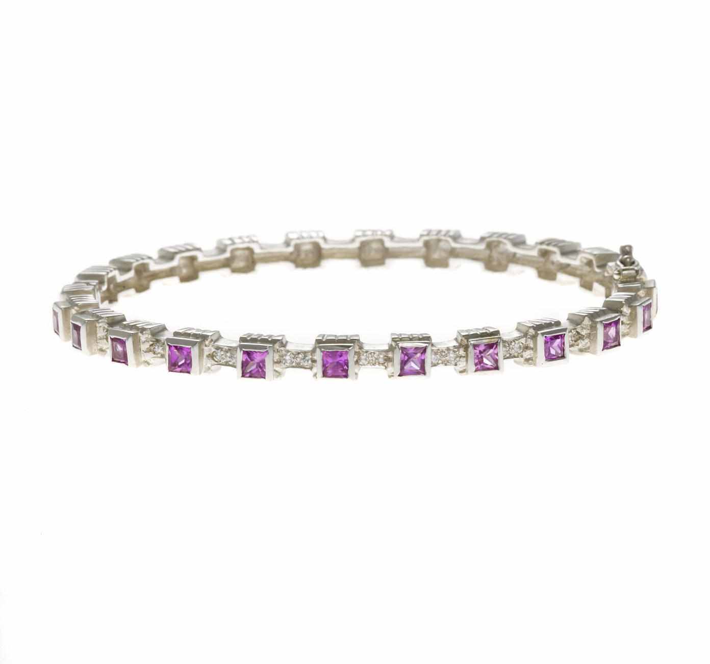 Appraisal: A pink sapphire and diamond bangle bracelet Doris Panos with