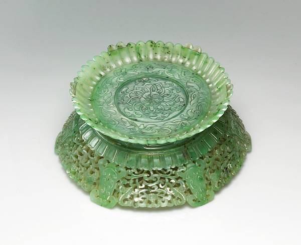 Appraisal: A fine 'spinach' jade stand Late th Century Thinly sectioned