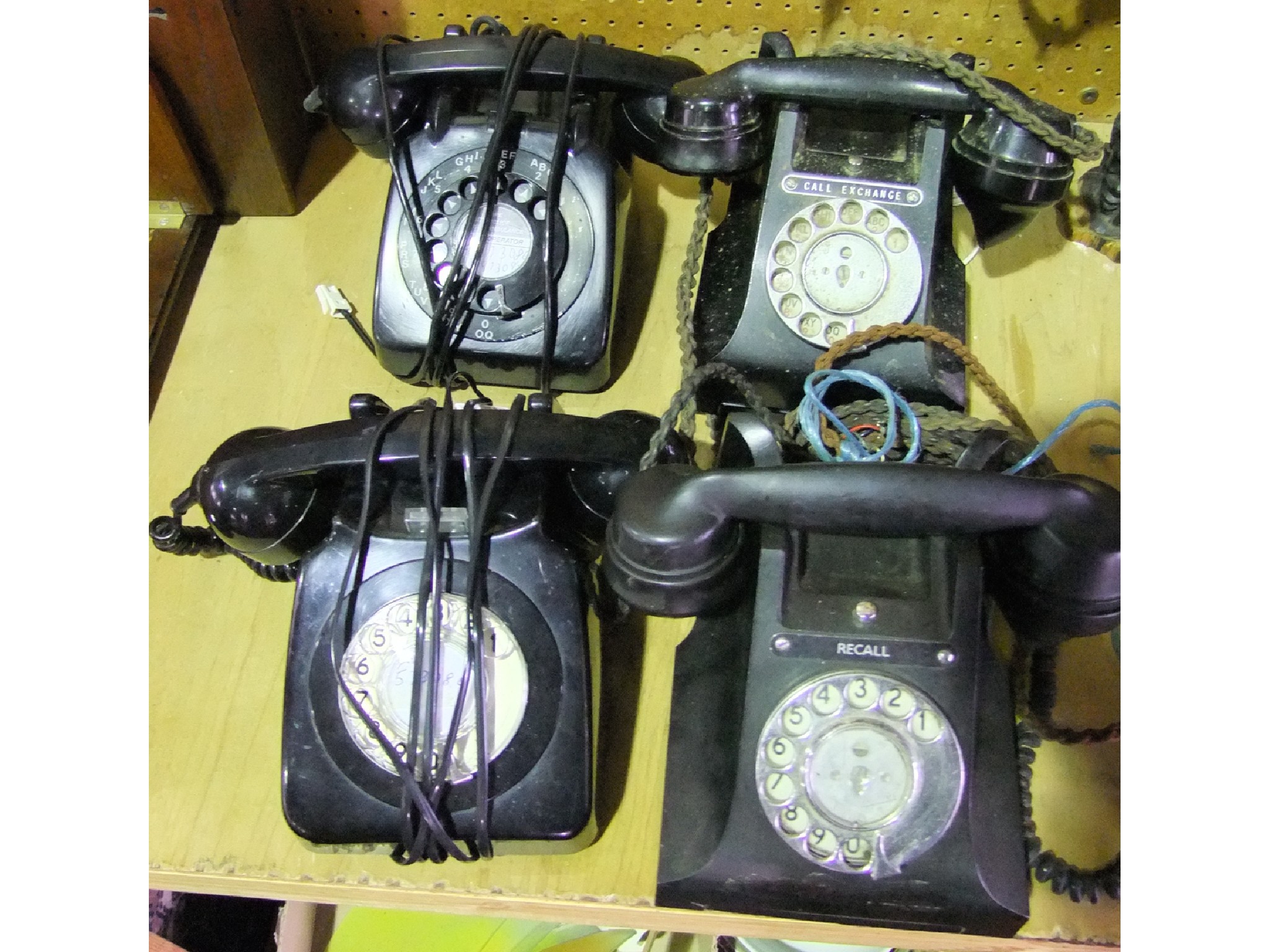 Appraisal: Four th century black bakelite cased telephone set of varying