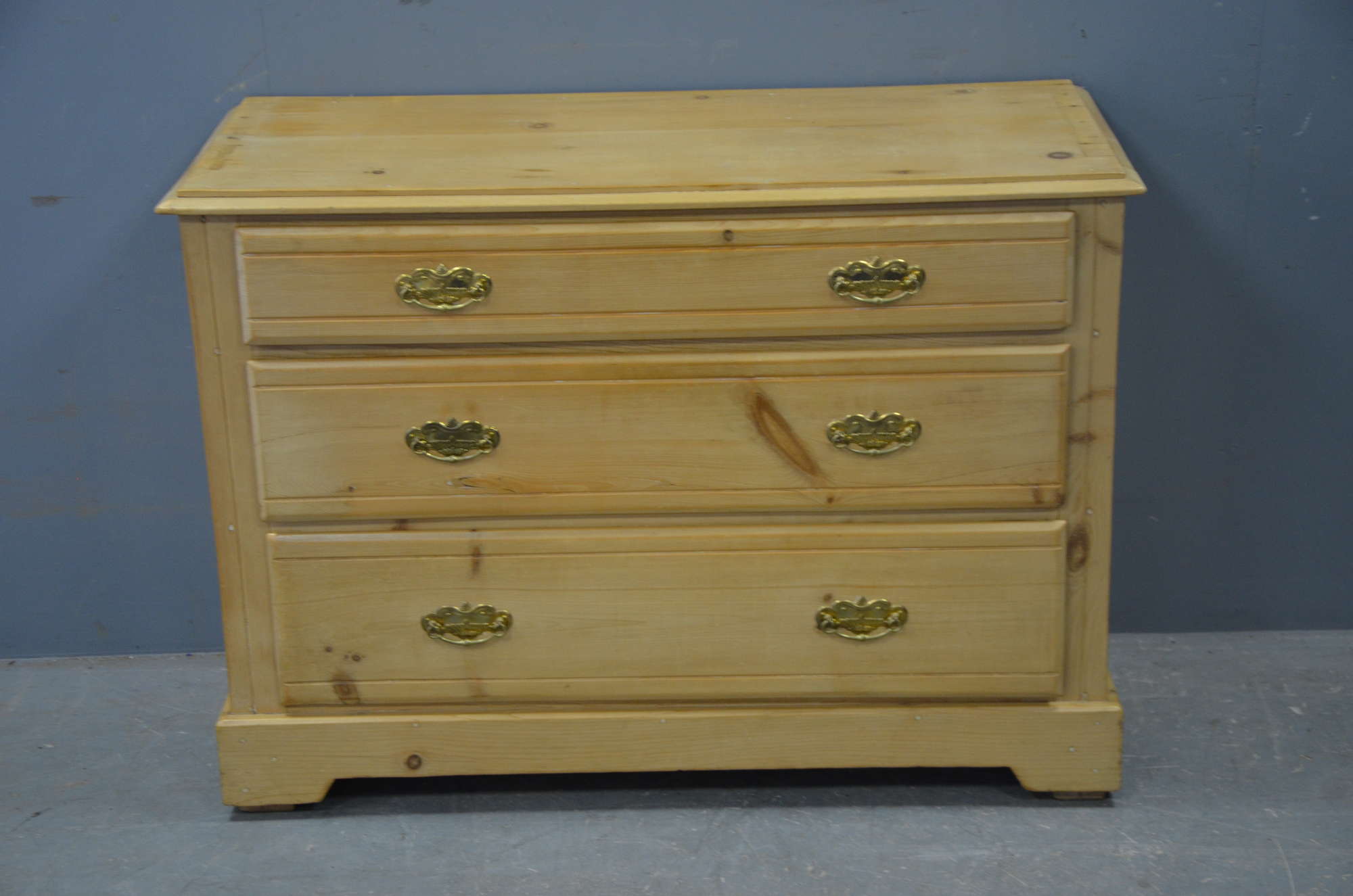 Appraisal: Pine three drawer chest on bracket feet