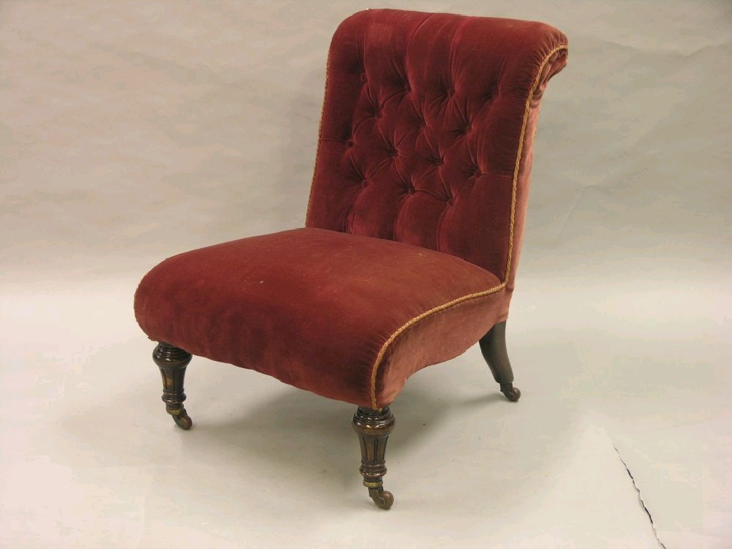 Appraisal: A Victorian nursing chair upholstered in a buttoned claret dralon