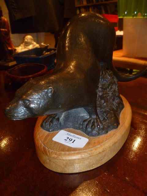 Appraisal: MICHAEL RIZZELLOA bronze model of an otter mounted on an