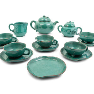 Appraisal: A Chinese Green Glazed Zisha Pottery Tea Set comprising a