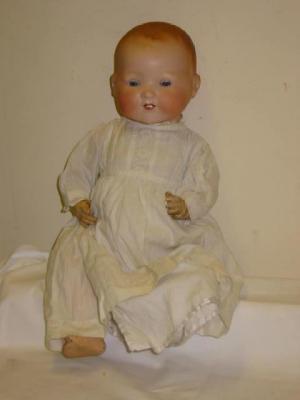 Appraisal: An Armand Marseille bisque head baby doll with blue glass