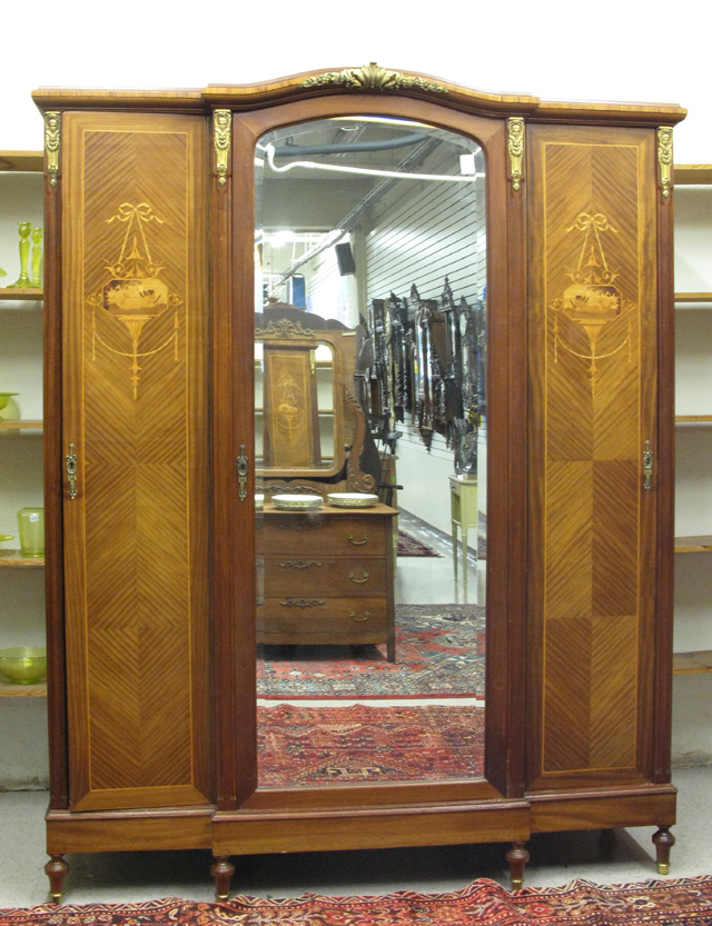 Appraisal: LOUIS XVI STYLE THREE-DOOR ARMOIRE of mahogany with ormolu mounts