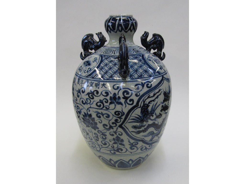 Appraisal: Oriental blue and white vase with painted decoration and three