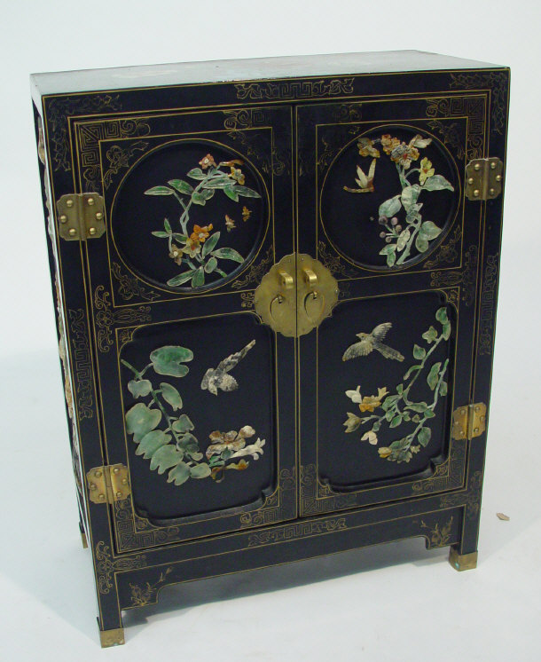 Appraisal: Oriental style black lacquered two door cupboard painted and gilded