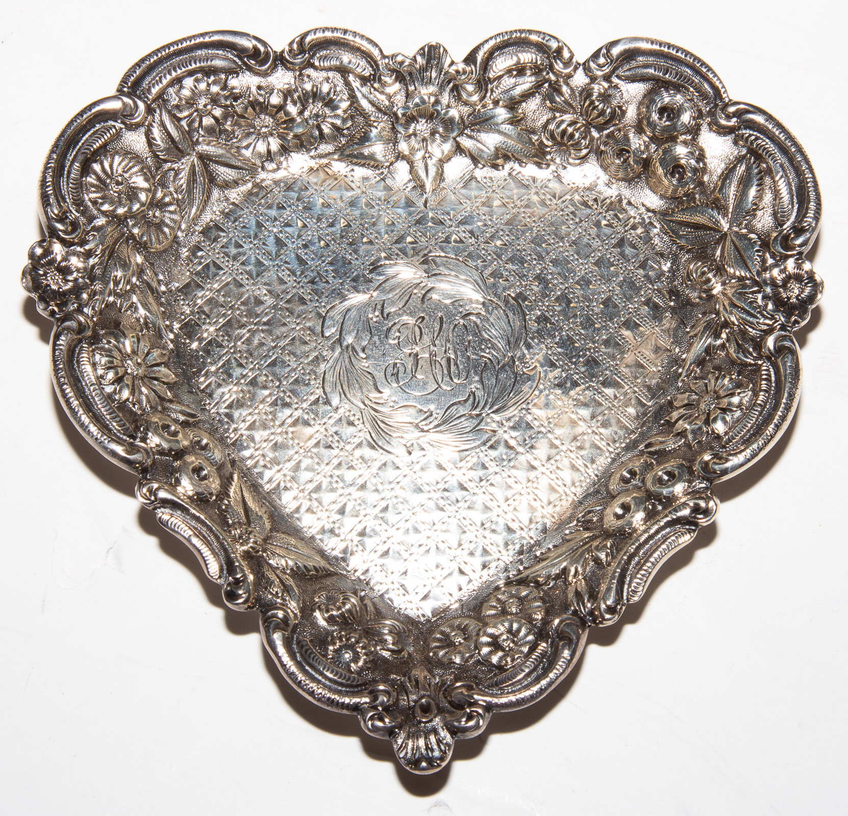 Appraisal: JENKINS JENKINS STERLING HEART-SHAPED RING TRAY Model with floral repousse