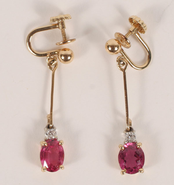 Appraisal: Gold K dangle earrings each with one oval pink tourmaline