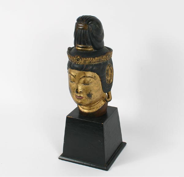 Appraisal: Carved and painted wooden head of an Asian goddess Overall