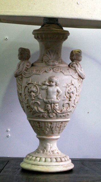 Appraisal: A white moulded lamp in the form of a Rococo