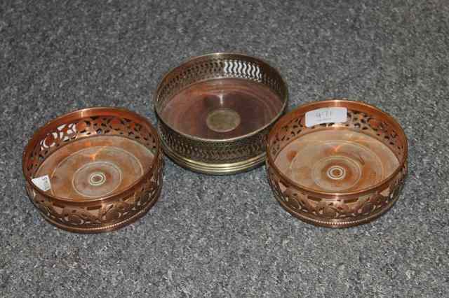 Appraisal: A PAIR OF SHEFFIELD PLATE COASTERS th Century and one