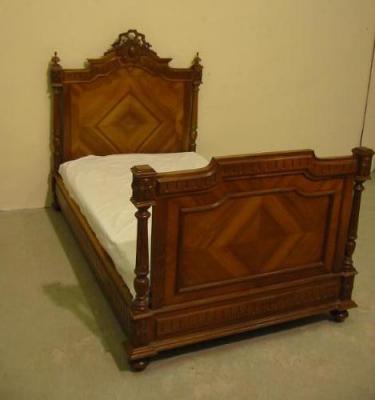 Appraisal: A FRENCH WALNUT BEDSTEAD c the quarter veneered and banded