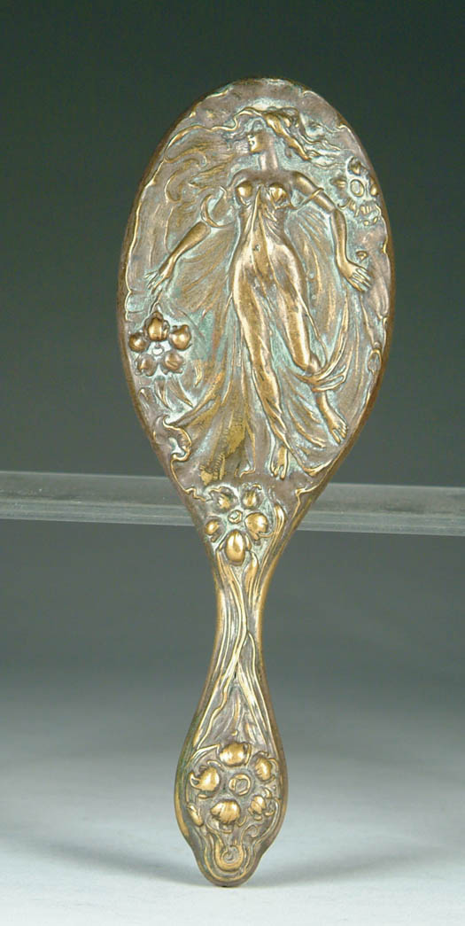 Appraisal: ART NOUVEAU BRASS HAND MIRROR Oval beveled glass in a