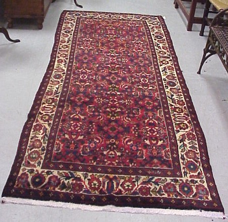 Appraisal: Persian Hamadan runner ' x ' red field with overall