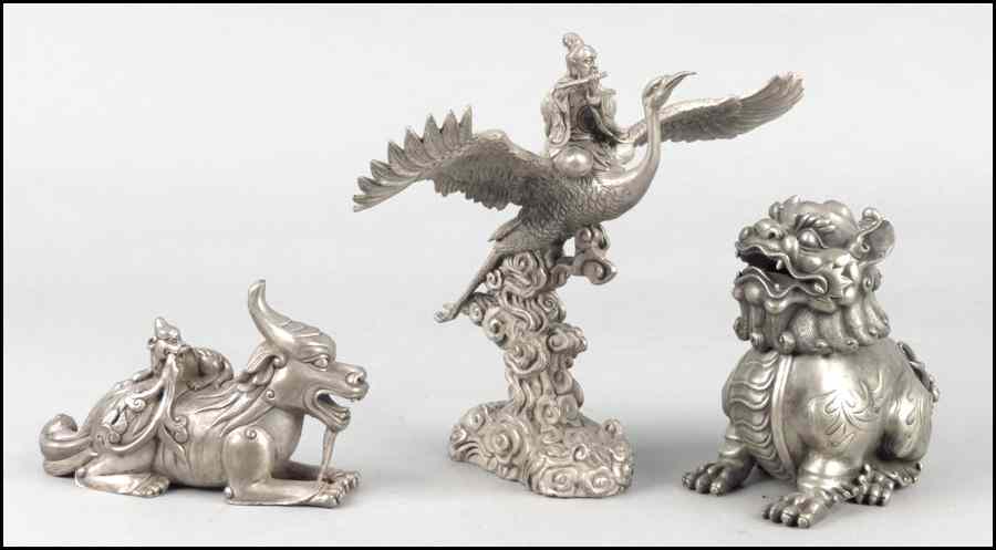 Appraisal: CHINESE SILVERED BRONZE FIGURE ON A CRANE Together with a