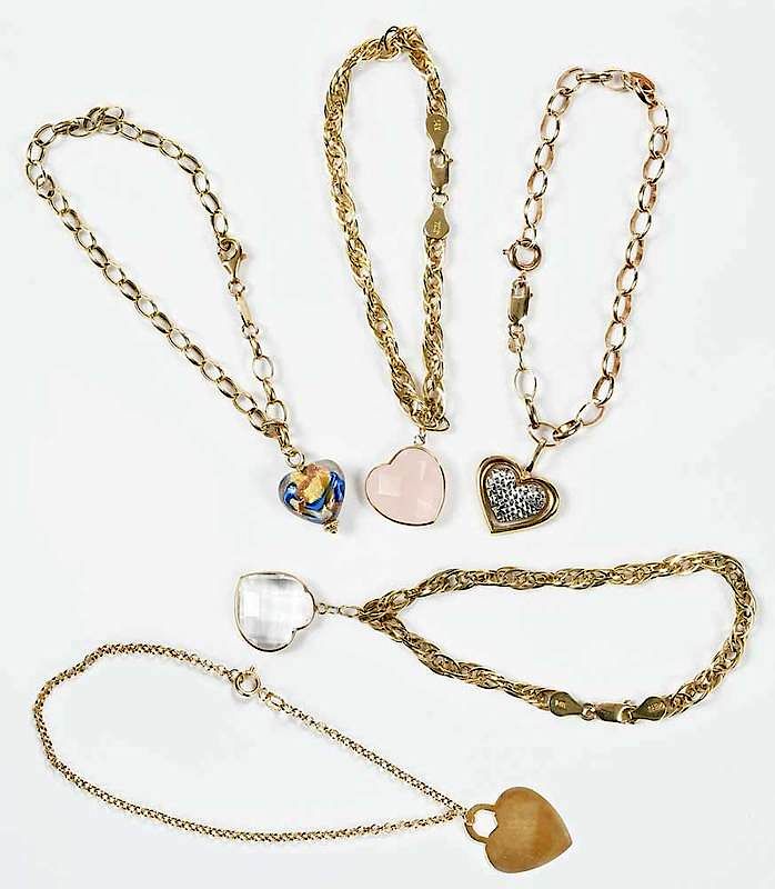 Appraisal: Five Gold Heart Bracelets assorted heart charms including glass white