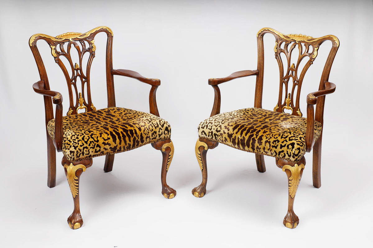 Appraisal: PAIR CARVED CHIPPENDALE STYLE ARM CHAIRS Carved and shaped frames