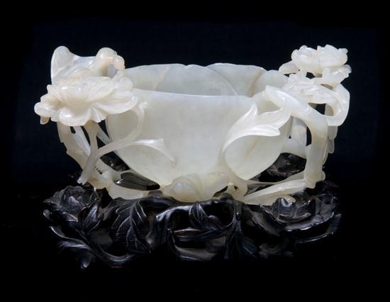 Appraisal: Near White Jade Bowl having an opened lotus blossom at