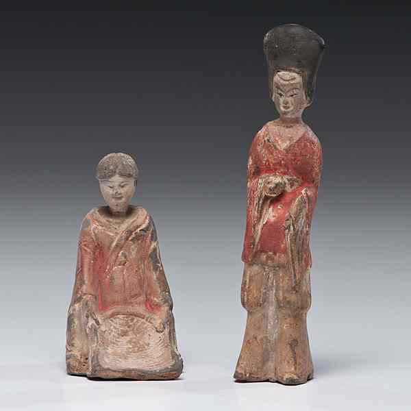 Appraisal: Two Tomb Figures Chinese a seated woman figure with sifting