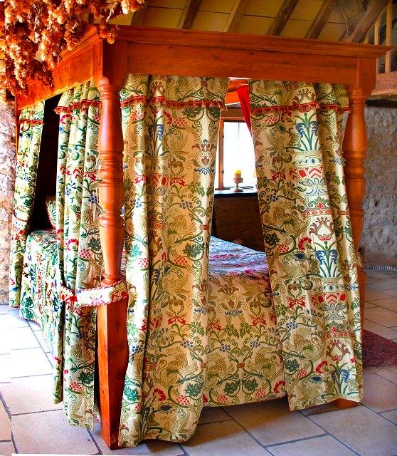 Appraisal: A modern solid yew wood four poster bed with panelled