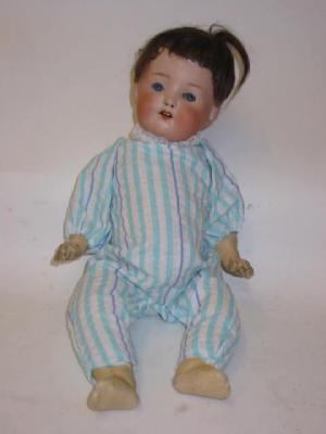 Appraisal: An Ernst Heubach bisque head boy doll with blue glass