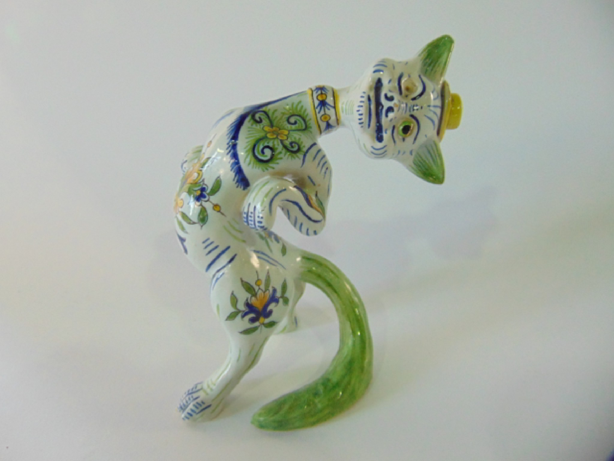 Appraisal: A humorous tin glazed earthenware continental model of a standing