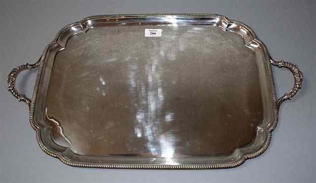 Appraisal: A SILVER BUTLER'S TRAY with shaped corners gadrooned edges and