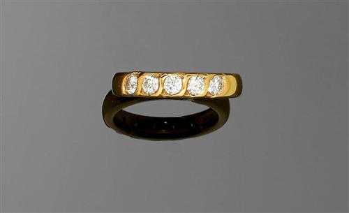 Appraisal: GOLD AND BRILLIANT-CUT DIAMOND RING Yellow gold Casual-elegant band ring