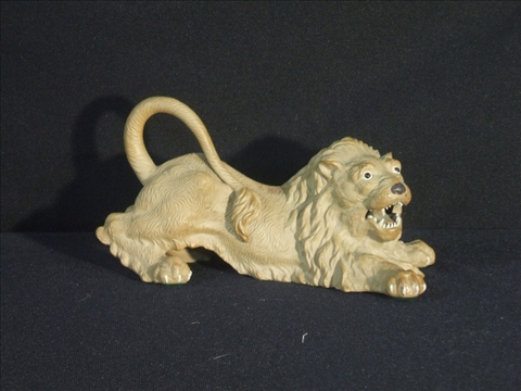 Appraisal: ASIAN POTTERY MODEL OF A RECUMBENT LION The brown pottery