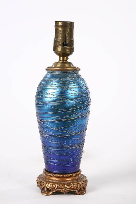 Appraisal: ART GLASS BOUDOIR LAMP Attributed to Durand Blue iridescent glass