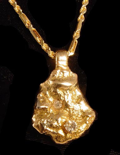 Appraisal: K AND DIAMOND NUGGET PENDANT ON HEAVY CHAIN K yellow