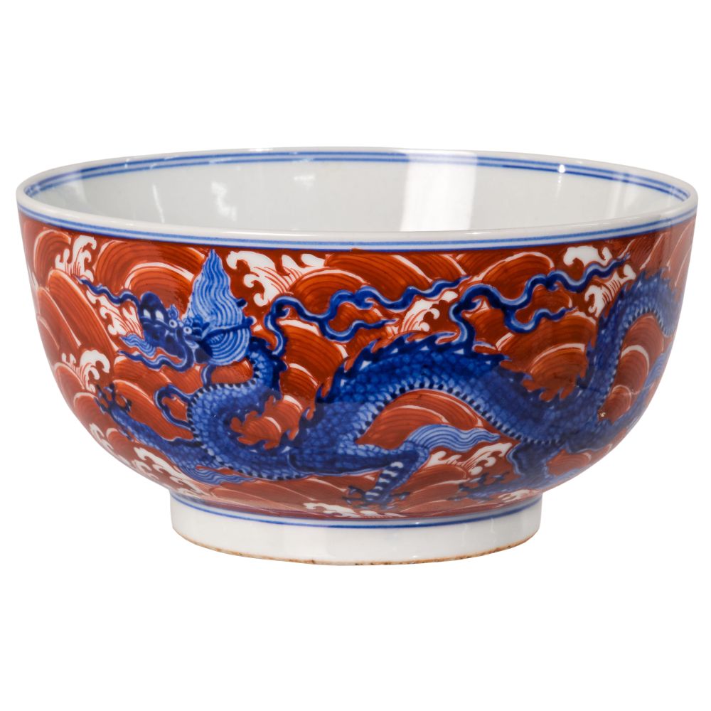 Appraisal: CHINESE BLUE AND WHITE PORCELAIN DRAGON BOWLHaving red overglaze waves