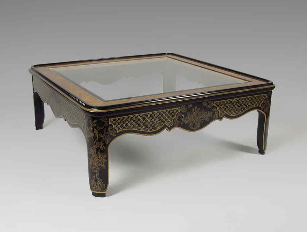 Appraisal: CHINOISERIE DECORATED GLASS TOP COFFEE TABLE Inset beveled oval glass