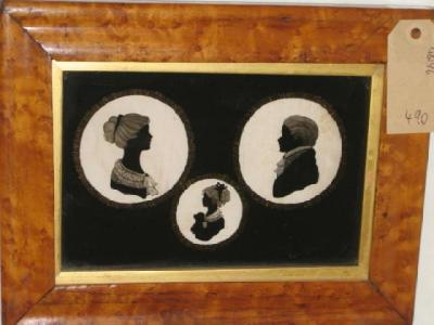 Appraisal: ENGLISH SCHOOL A family of three silhouette portraits in verre