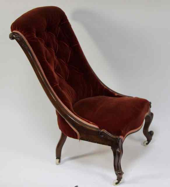 Appraisal: A Victorian carved and button upholstered nursing chair circa