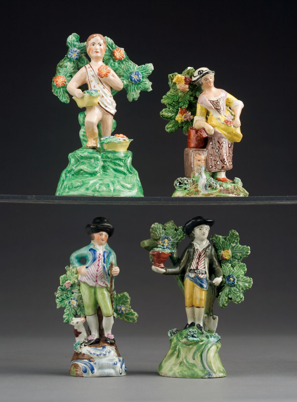 Appraisal: THREE STAFFORDSHIRE POTTERY BOCAGE FIGURES CIRCA - Comprising a gentleman