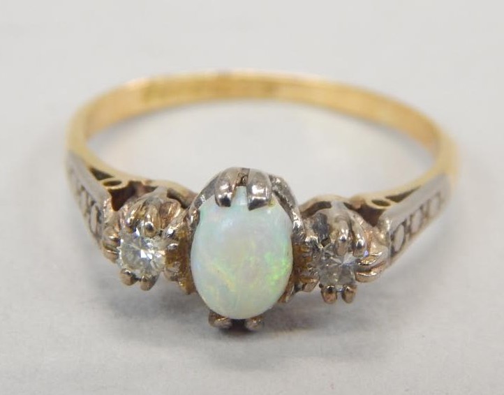 Appraisal: An ct gold opal and diamond dress ring with central