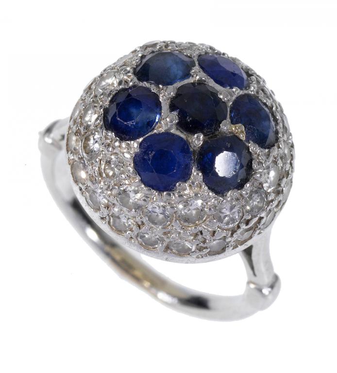 Appraisal: A SAPPHIRE AND DIAMOND CLUSTER RING of domed form with