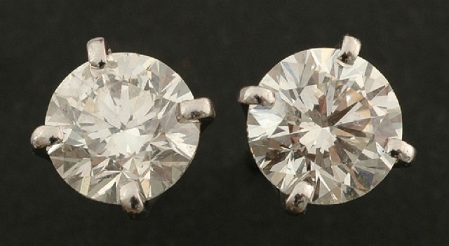 Appraisal: A pair of diamond stud earrings Each claw set round