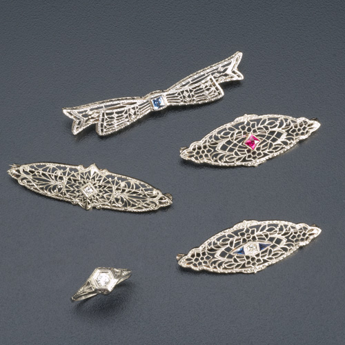 Appraisal: Four Art Deco filigree brooches and a ring in k