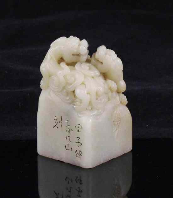 Appraisal: A Chinese cream and beige soapstone square seal finely carved