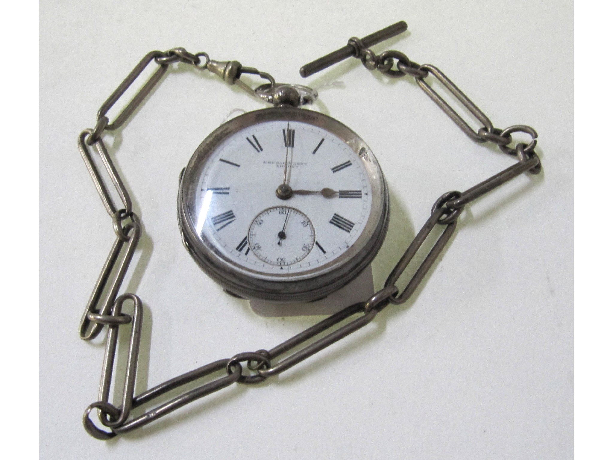 Appraisal: A silver cased pocket watch on silver Albert