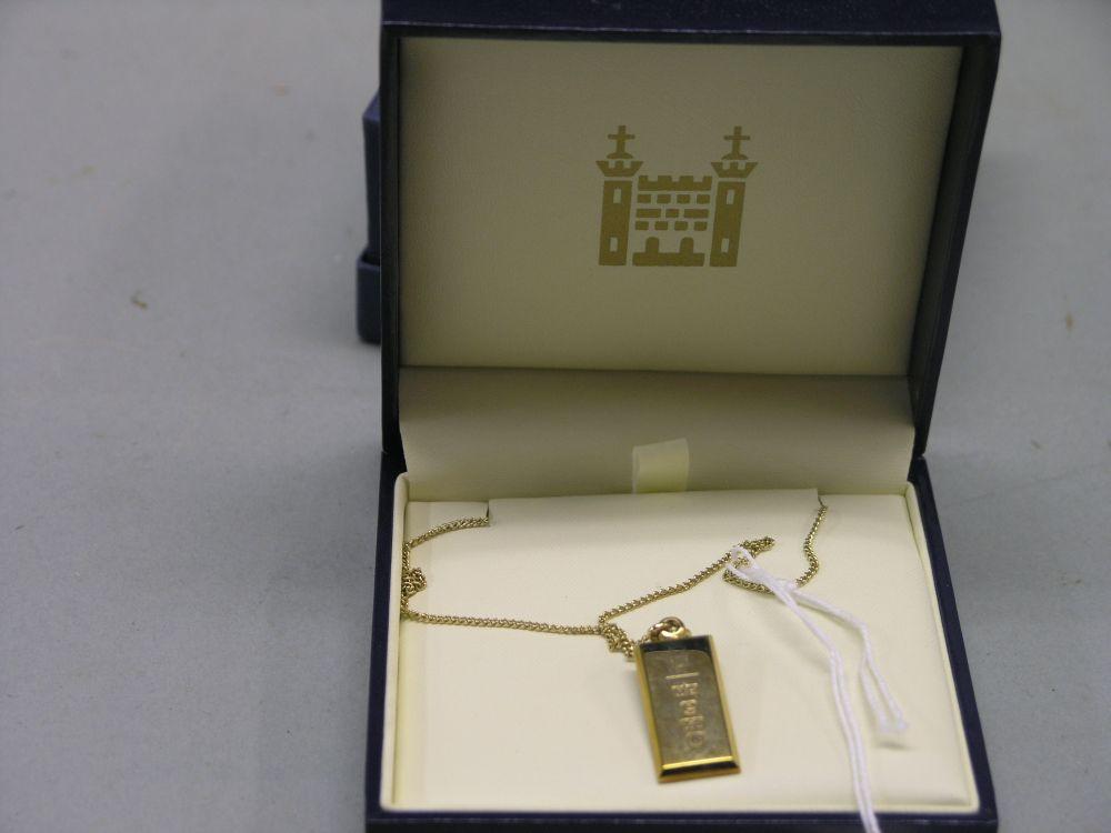 Appraisal: A ct gold ingot pendant on chain in box -