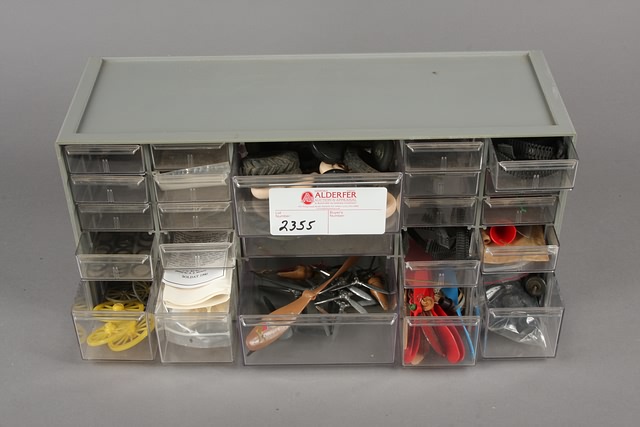 Appraisal: Storage case with metal cannon wheels and plastic airplane parts