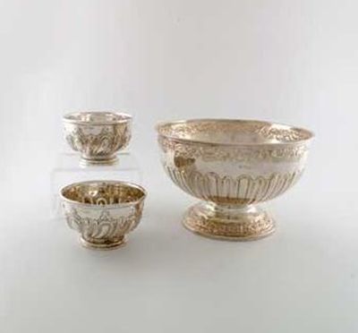 Appraisal: An Edwardian part fluted rose bowl with embossed borders by