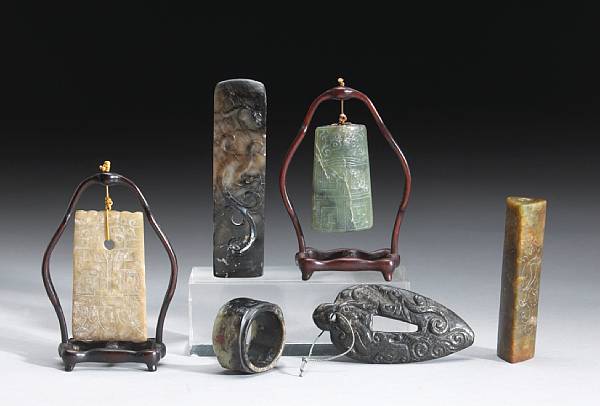 Appraisal: A group of five archaistic jade decorations including one pale