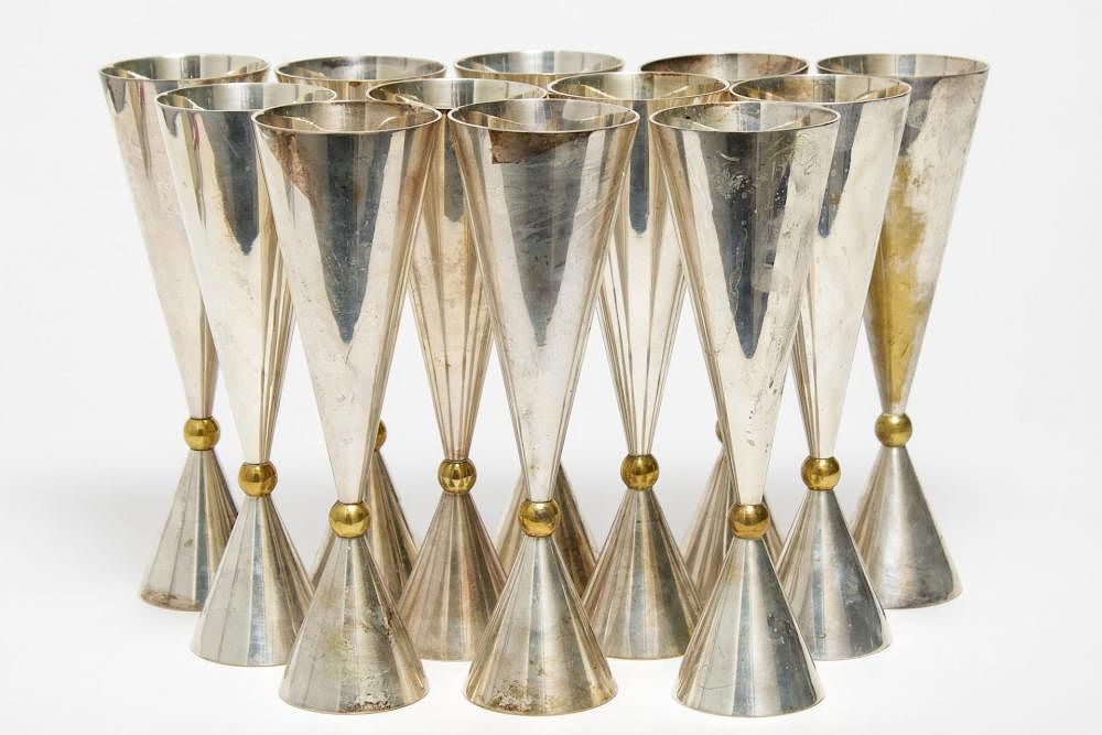 Appraisal: Mid-Century Modern Silver-Toned Wine Goblets Mid-Century Modern silver-toned wine glasses