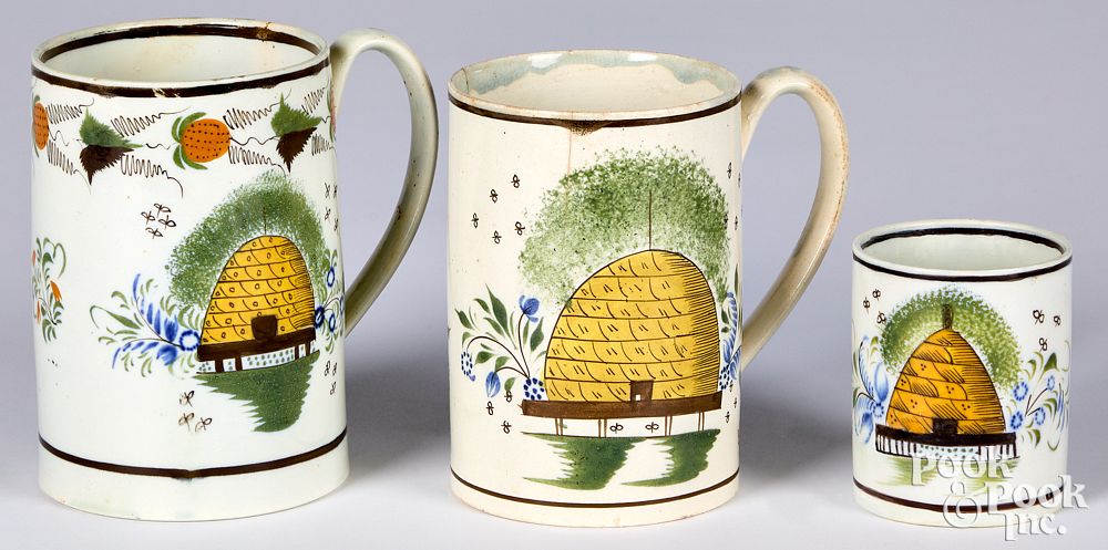 Appraisal: Three pearlware mugs th c with beehive decora Three pearlware